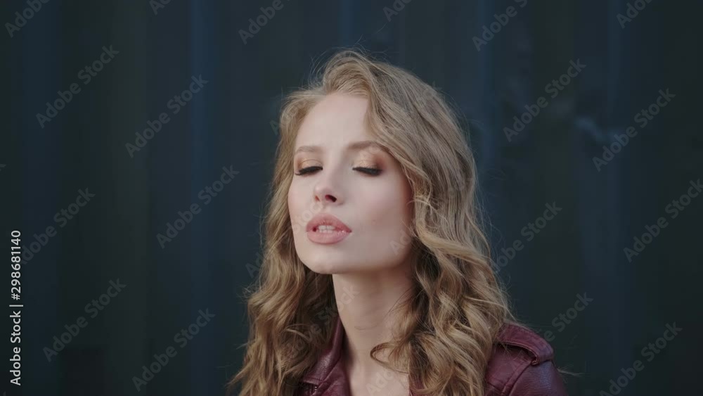 beautiful girl arrogantly looking at the camera beautiful girl arrogantly looking at the camera