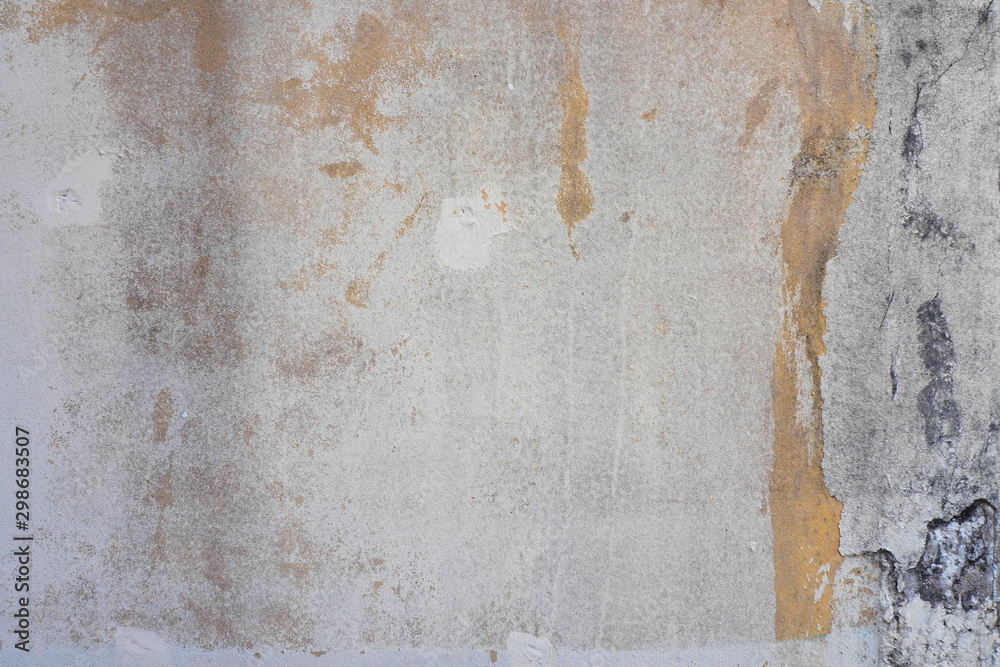 Stains and cracks on the old concrete wall for rustic and grungy background and decoration. Art and interior concept Stains and cracks on the old concrete wall for rustic and grungy background and decoration. Art and interior concept