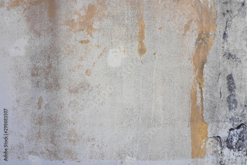 Stains and cracks on the old concrete wall for rustic and grungy background and decoration. Art and interior concept