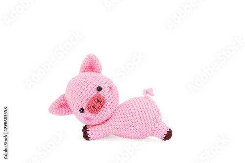 Crochet doll. Amigurumi or Crochet doll of a cute pig isolated on white background