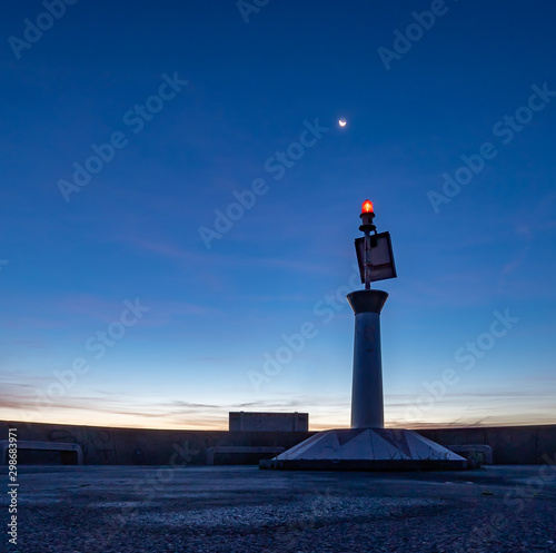 Maritime navigation beacon at dawn