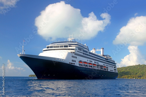 World voyage cruise ship at anchor off the beautiful tropical island of Bora Bora  French Polynesia.