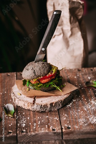 Vegetarian burger with chickpeas on a fresh homemade black bun