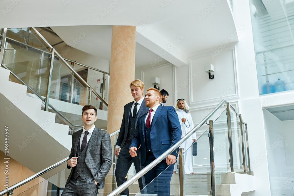 Everyone down the stairs, men in tuxedo. After business meeting, discuss Everyone down the stairs, men in tuxedo. After business meeting, discuss