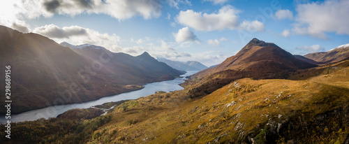 aerial panorama of loch leven shot from the hillside above kinlochleven near fort william on the west highland way in the argyll region of the highlands of scotland in autumn on a bright cloudy day
