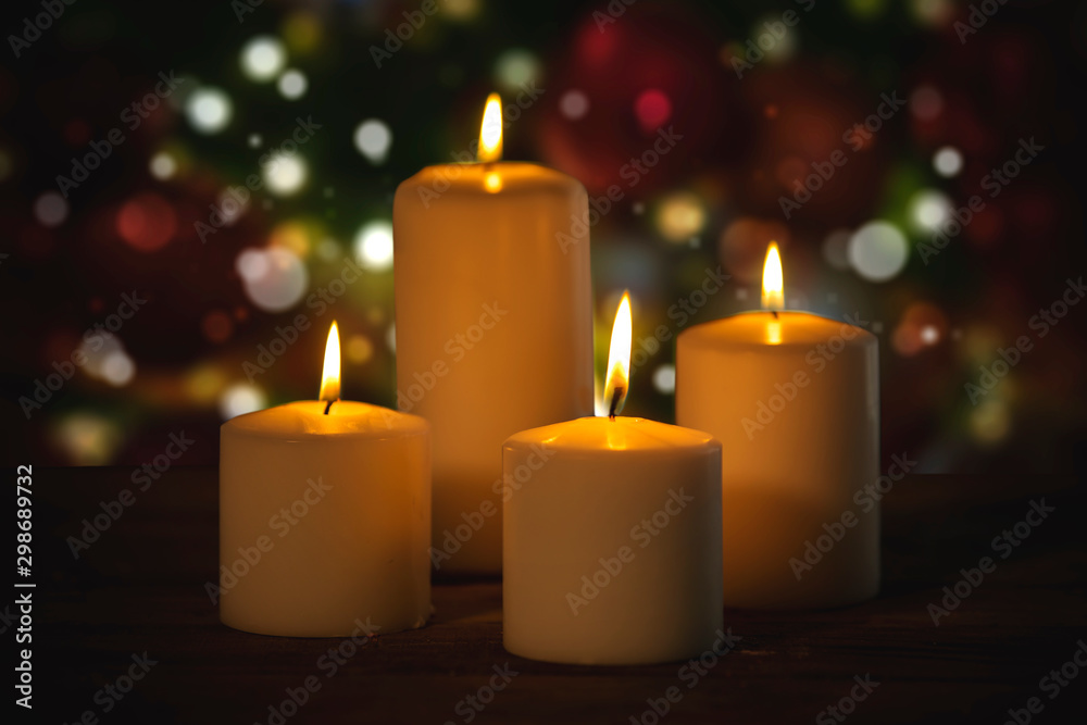 Christmas candles with blurred twinkling light Christmas candles with blurred twinkling light