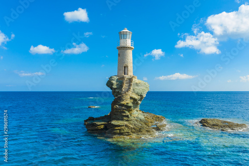 The beautiful Lighthouse Tourlitis of Chora in Andros island, Cyclades, Greece photo