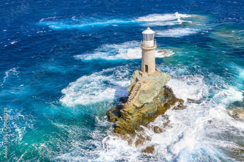 The beautiful Lighthouse Tourlitis of Chora in Andros island, Cyclades, Greece photo