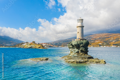 The beautiful Lighthouse Tourlitis of Chora in Andros island, Cyclades, Greece photo