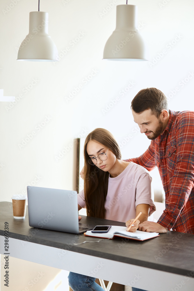 Portrait of young family couple spending time at home, choosing place where to go in saturday evening, family concept, portrait Portrait of young family couple spending time at home, choosing place where to go in saturday evening, family concept, portrait