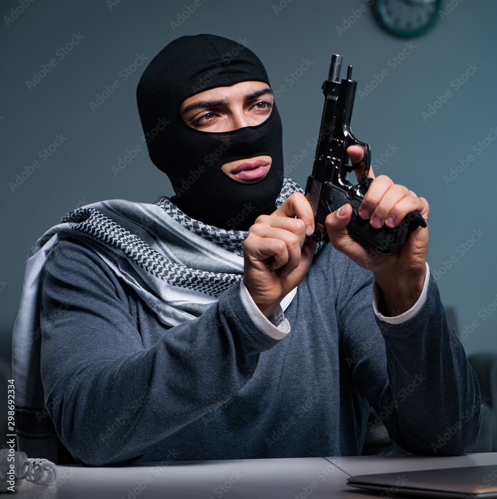 Terrorist burglar with gun asking for money ransom Terrorist burglar with gun asking for money ransom