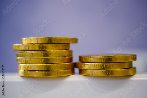 fake money - chocolate in the form of coins covered with Golden foil   photo