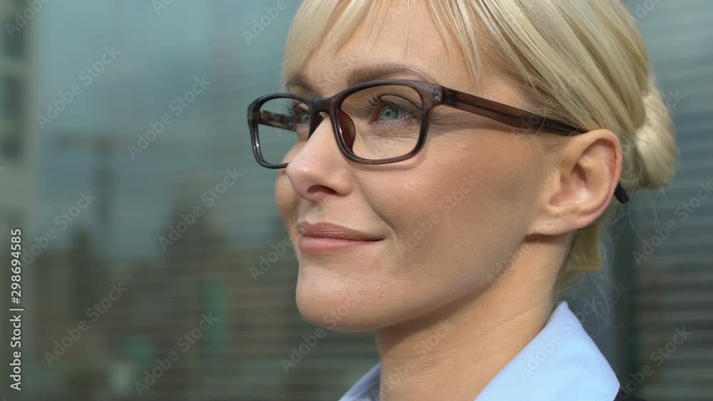 Inspired businesswoman looking aside, thinking about successful deal, motivation Inspired businesswoman looking aside, thinking about successful deal, motivation