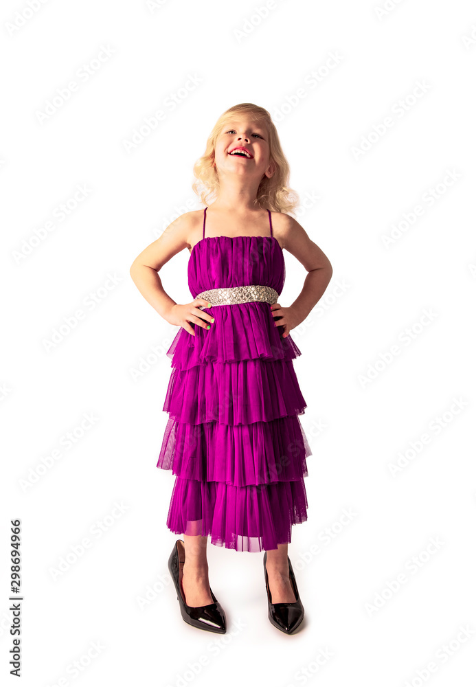 amazing girl in raspberry retro dress and mother's patent leather high-heeled shoes smiling looks at the top. Isolated on a white background.