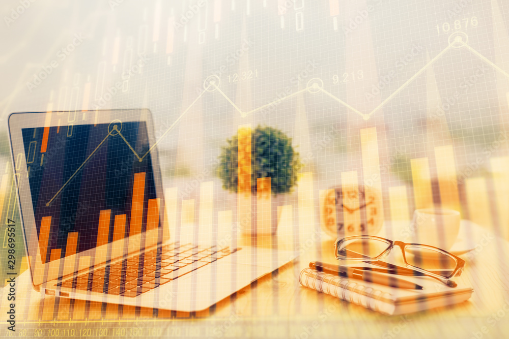 Stock market graph on background with desk and personal computer. Multi exposure. Concept of financial analysis. Stock market graph on background with desk and personal computer. Multi exposure. Concept of financial analysis.