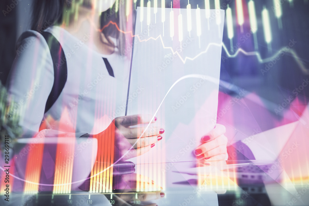 Double exposure of hands making notes with forex chart huds. Stock market concept. Double exposure of hands making notes with forex chart huds. Stock market concept.
