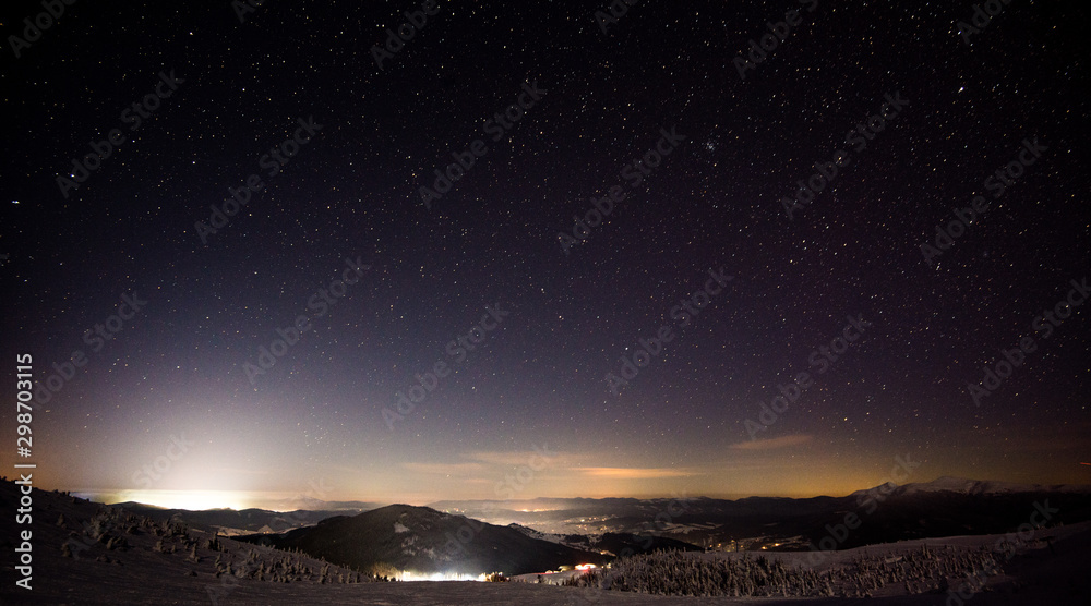 Night view of the ski resort with hills