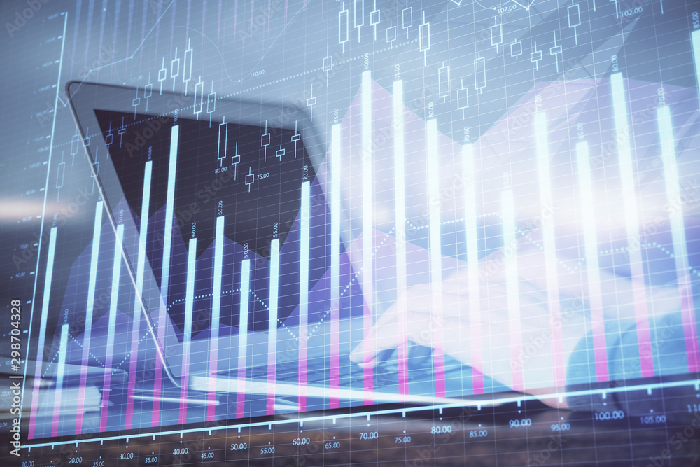 Double exposure of businessman's hands with laptop and stock market graph background. Concept of research and trading.