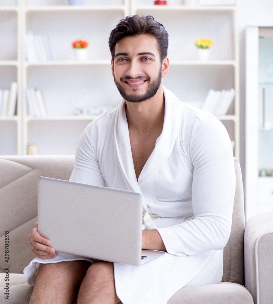 Young man freelancer working from home on a laptop Young man freelancer working from home on a laptop