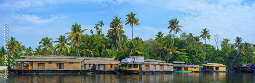 Panoramic river view and traditional house boat in Kerala's Backwaters, India. photo