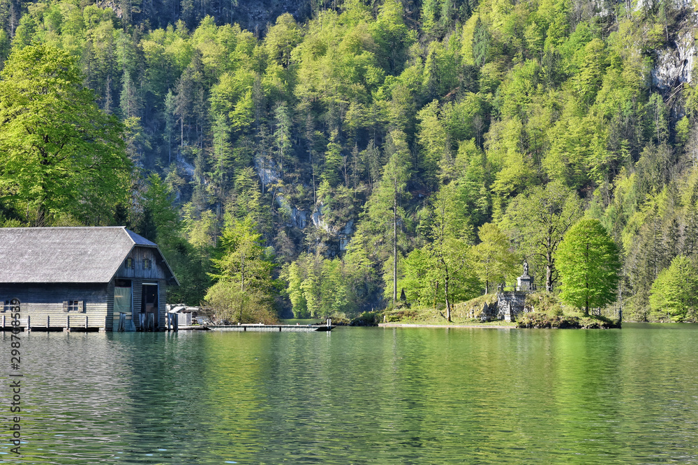 Fototapeta premium Berchtesgaden, Germany - May 2019. Berchtesgaden National Park, Bavaria (Bayern), Germany. Passenger boat on the Koenigssee lake. Beautiful view of nature near Konigssee lake. electric boat