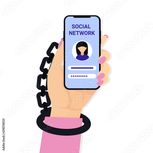 Internet, social media network addiction concept. Woman hand hold mobile phone and Handcuffs.