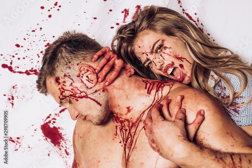 Piece of meat. Happy Halloween. Muscular hands. Bloody halloween. Crazy couple. photo