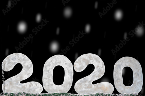 Happy new year 2020 isolated on black background with copy space for text, for holiday card. Blurred snowflakes, snow.