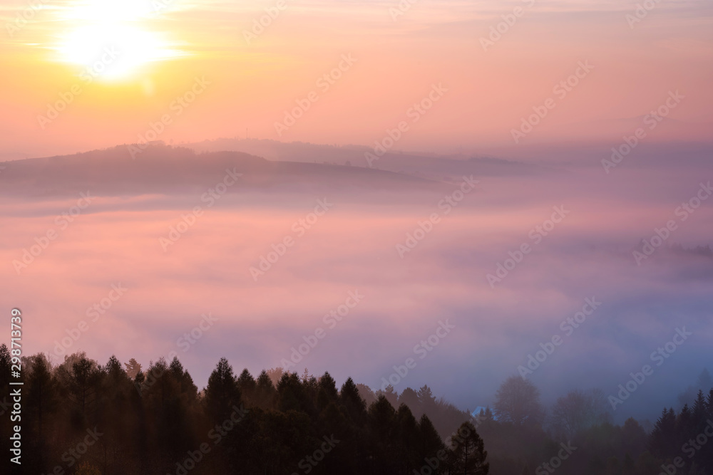 Beautiful Sunrise Over Foggy Rolling Hils and Forest at Fall
