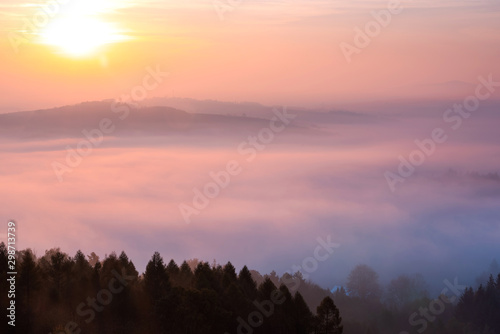 Beautiful Sunrise Over Foggy Rolling Hils and Forest at Fall