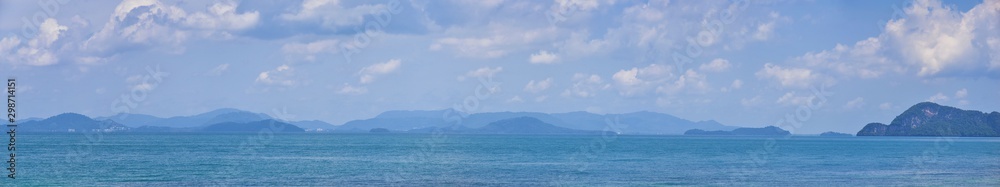 Island, Ocean views near Phuket Thailand with Blues, Turquoise and Greens oceans, mountains, boats, caves, trees resort island of phuket Thailand. Including Phi Phi, Ko Rang Yai, Ko Li Pe and other is