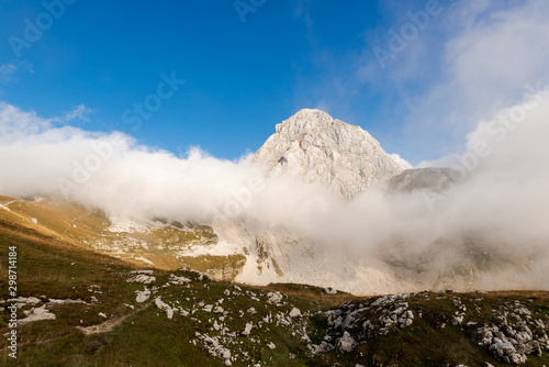 Mangart Peak in Julian Alps Mountains. Dramatic Weather
