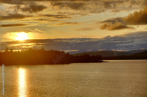 Mountain range Marsfjaellen seen in sunset from lake Kultsjon in Vasterbotten, Sweden photo