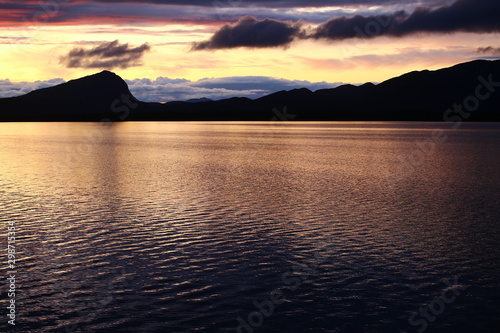 Mountain range Marsfjaellen seen in sunset from lake Kultsjon in Vasterbotten, Sweden photo