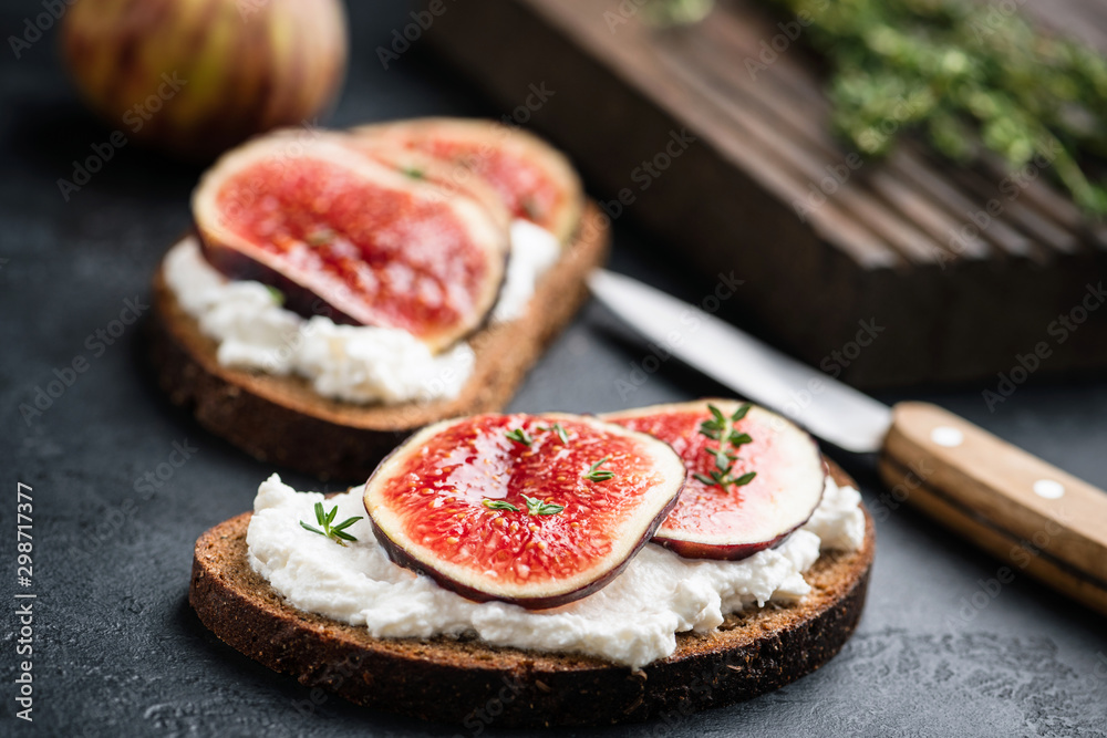 Rye bread snack toast with soft white cheese and figs. Healthy vegetarian appetizer Rye bread snack toast with soft white cheese and figs. Healthy vegetarian appetizer