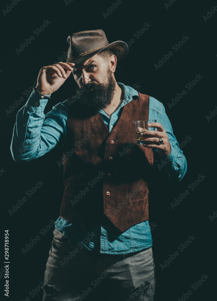 Whisky elegant. Man with beard holds glass of brandy. Bearded businessman in elegant suit with glass of whiskey.