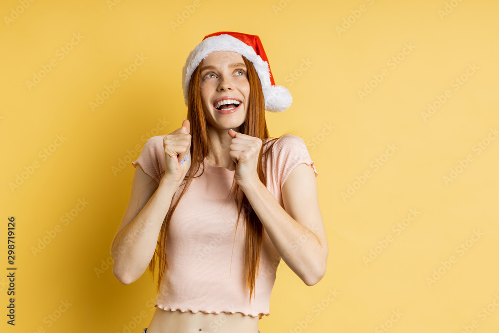 Beautiful caucasian female model wearing santa hat Beautiful caucasian female model wearing santa hat