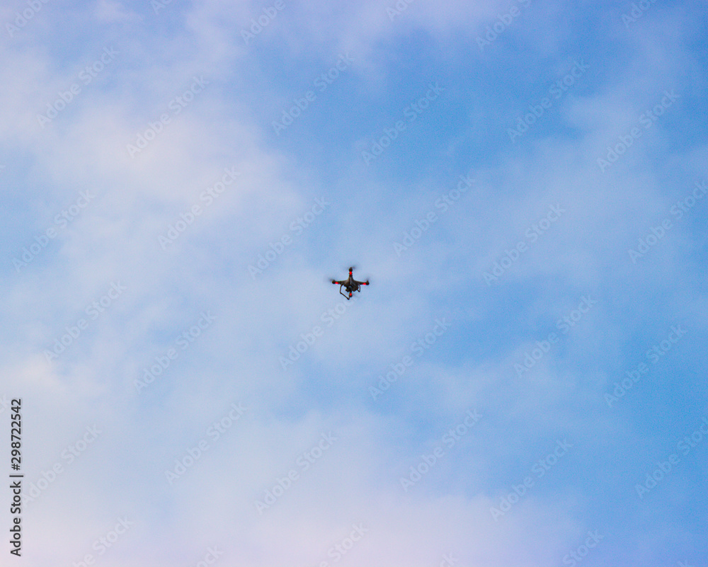 Quadrocopter in the air. Bulbs flicker near the blades Quadrocopter in the air. Bulbs flicker near the blades