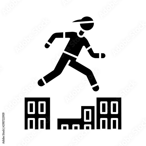 Parkour glyph icon. Traceur running in city environment. Traversing obstacles. Person jumping in urban space. Street workout. Silhouette symbol. Negative space. Vector isolated illustration
