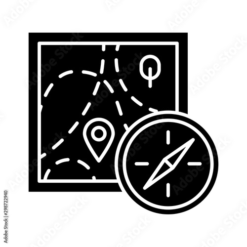 Foot orienteering glyph icon. Topographical map and compass. Navigating in unfamiliar terrain. Navigation equipment. Hiking, tracking. Silhouette symbol. Negative space. Vector isolated illustration photo