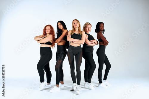 Mix ethnic beauty or interracial friendship, relationship. Different ethnicity female posing- Caucasian, African, American on white background