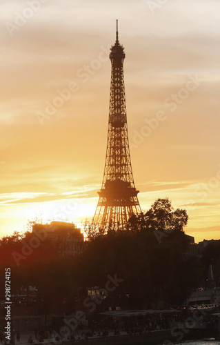 The Eiffel Tower at Sunset, Paris, France.It is the most popular travel place and global cultural icon of the France and the world. © kovalenkovpetr