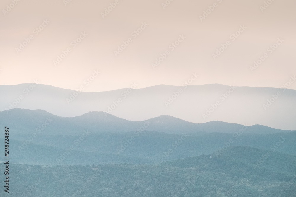 blue ridge mountains at sunset with mist