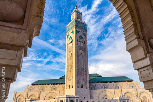 View of Hassan II mosque tower against blue sky - The Hassan II Mosque or Grande Mosquée Hassan II is a mosque in Casablanca, Morocco.