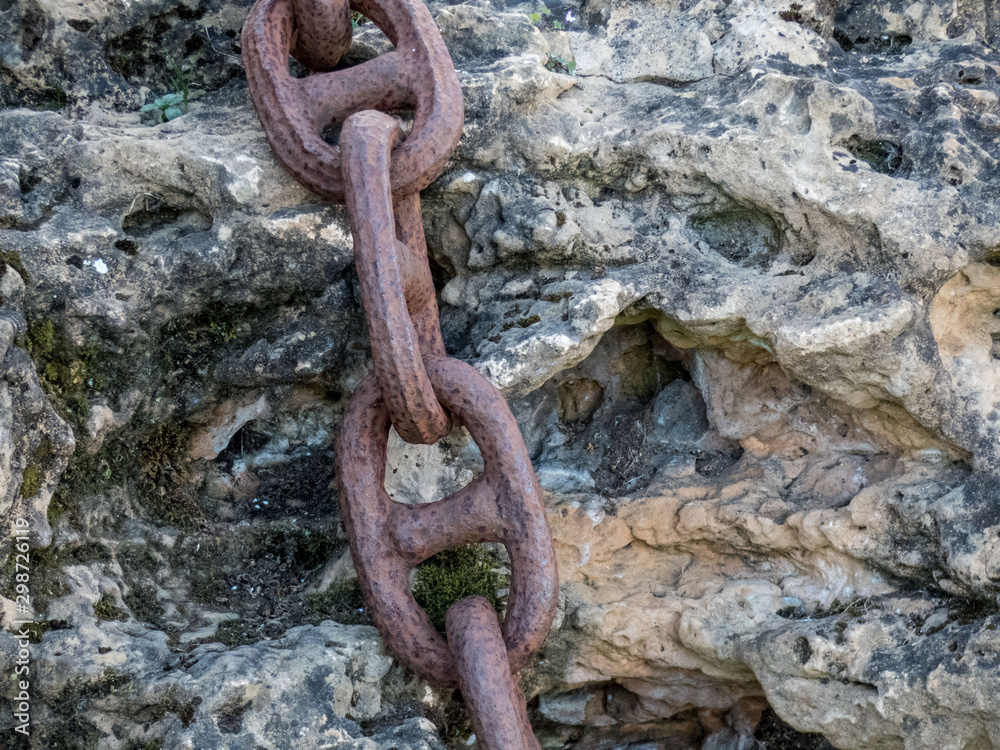 Close up Thick Rusty Chain Background Image. Old rusty metal chain on stone surface. Close up Thick Rusty Chain Background Image. Old rusty metal chain on stone surface.