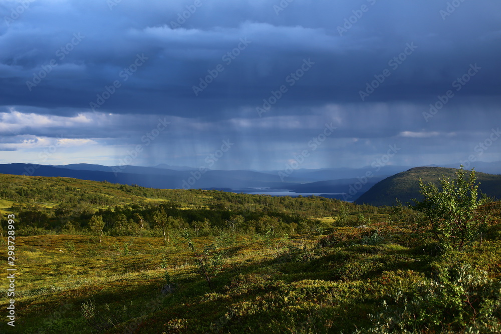 Sun and rain in Blasjofjalls nature reserve near the Wilderness Road in Sweden