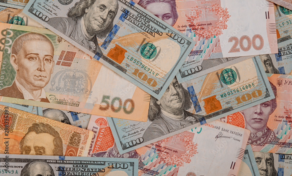 Money dollars and hryvnia, close-up top view concept finance