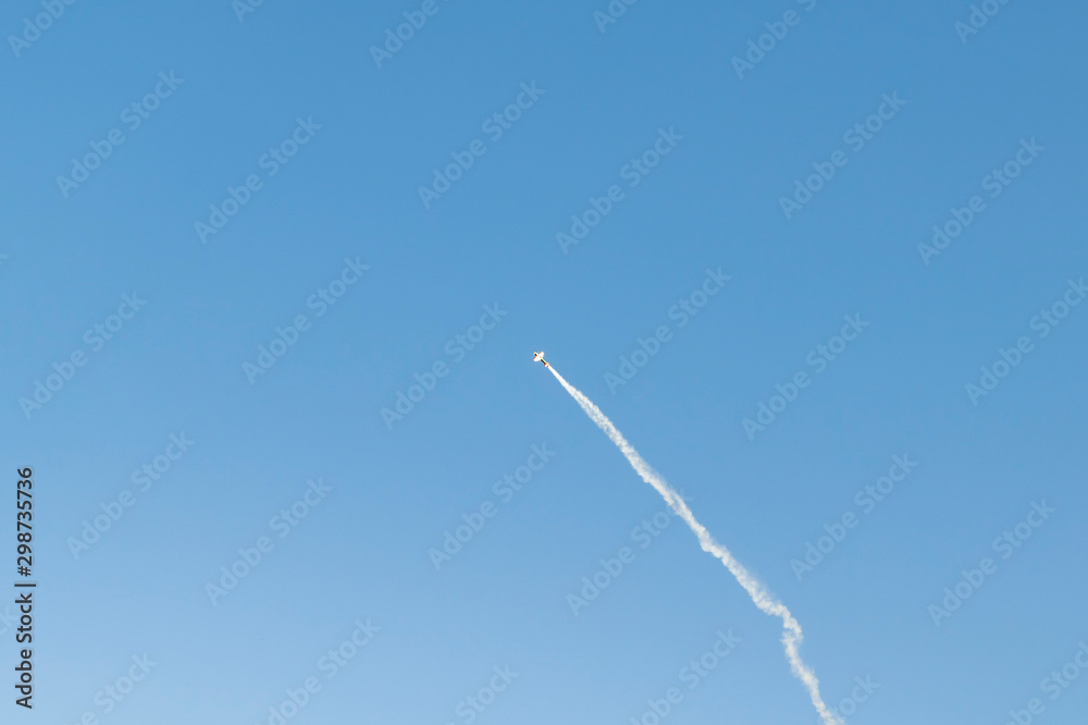 Small plane performs aerobatics in the sky Small plane performs aerobatics in the sky