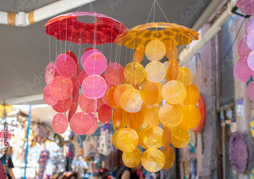 A wind bell made of mother of pearl. It makes noise in the wind. photo