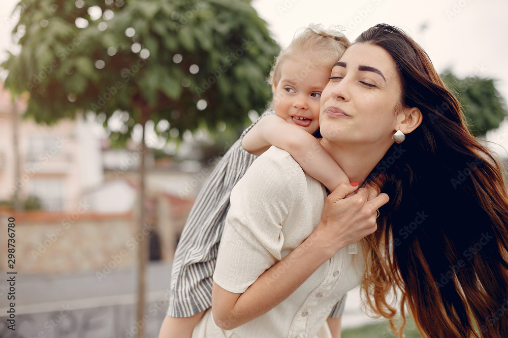 Fototapeta premium Mother with daughter. Family in a park. Cute little girl